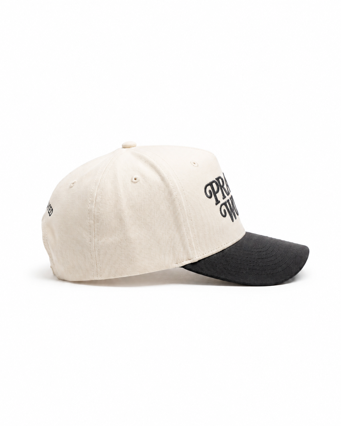 Two-tone cap with black visor and beige top on a white background